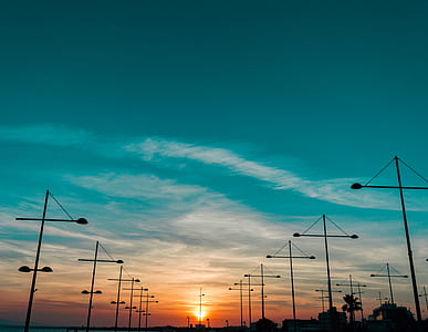 silhouette of post under cloudy sky thumbnail
