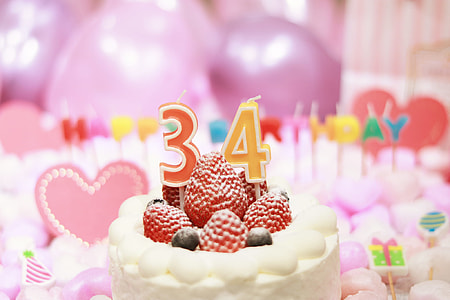 34 candle on strawberry cake thumbnail