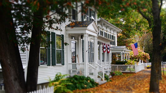 USA flag hanging outside house thumbnail