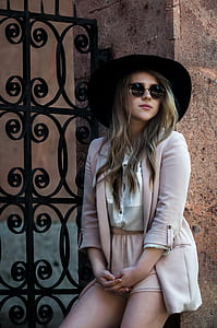 woman leaning on a concrete wall thumbnail