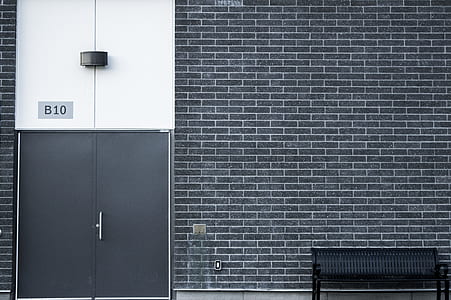 black bench near door thumbnail