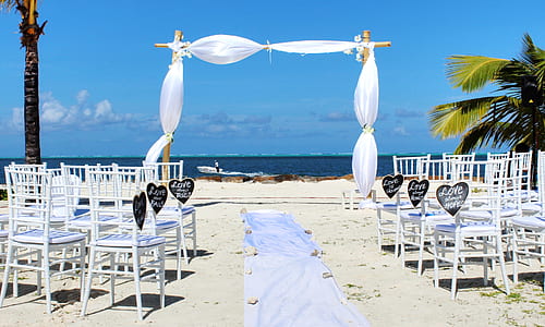 white chair lot on beach thumbnail