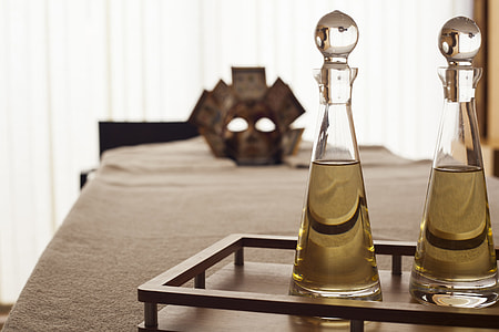 two clear glass decanters on brown wooden traly thumbnail