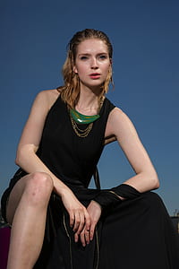 woman wearing black dress thumbnail
