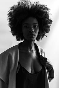 grayscale photo of woman wearing blazer thumbnail