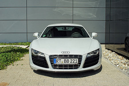 white Audi vehicle near building at daytime thumbnail