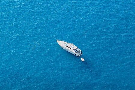 white yacht in the middle of body of water thumbnail