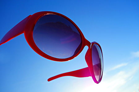 pink framed sunglasses under clear blue sky at daytime thumbnail