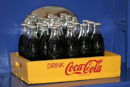 unopened glasses Coca-Cola bottles thumbnail