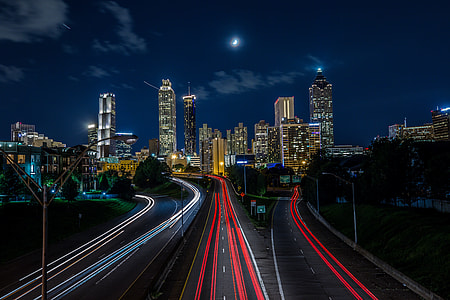 time lapse photography of cars heading towards city thumbnail