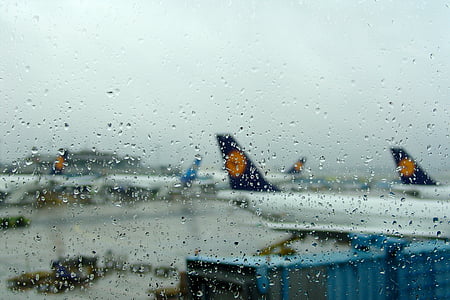 water dew on glass with airplane viewing deck thumbnail