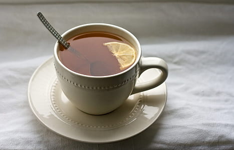 tea with lemon on white ceramic mug thumbnail