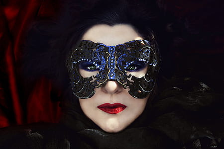 person wearing blue masquerade thumbnail