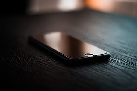 Selective Focus Photography of Black Iphone Turned-off on Table thumbnail