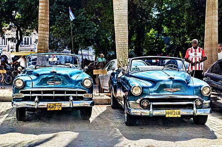 Blue Convertible Vintage Car Parked during Daytime thumbnail
