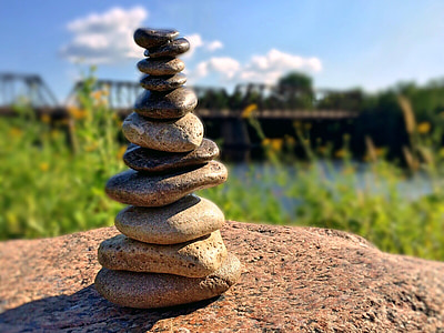shallow focus photography of cairn thumbnail
