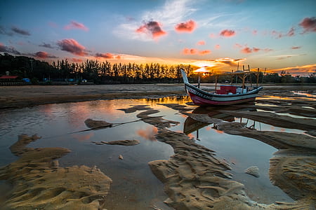 white and red boat on creek thumbnail