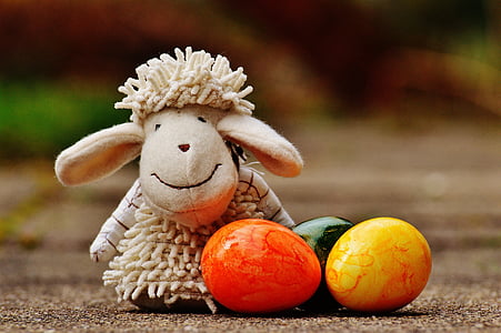 beige sheep plush toy beside eggs thumbnail