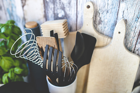 brown and black kitchen ladles in container thumbnail