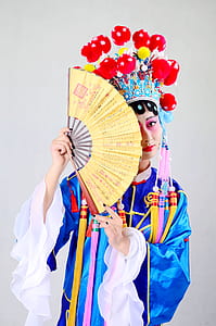 woman holding handfan thumbnail