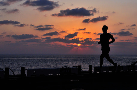 silhouette photo of man while running thumbnail