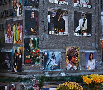 Michael Jackson memorabilia photos on gray wall thumbnail