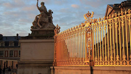 statue near yellow fence thumbnail