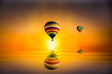 body of water under hot hair balloons during sunset thumbnail