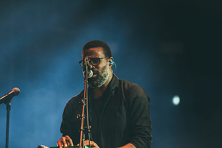 man wearing black shirt singing thumbnail