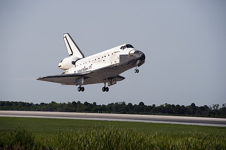 photo of white and black NASA spacecraft under blue sky at daytime thumbnail