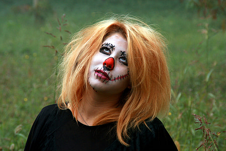 woman wearing black shirt with makeup in grass field thumbnail