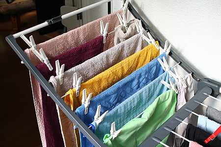 assorted-color towels hanged on rack thumbnail