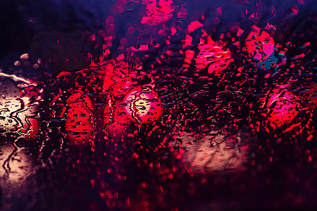 Abstract shot of rain and lights through glass texture window thumbnail
