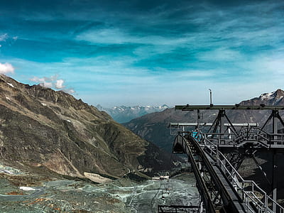 cable car facility in mountain range thumbnail