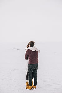 Man and Woman Kissing on Snow Field thumbnail