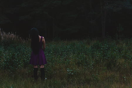 Photo of Woman Standing on Grass Field thumbnail