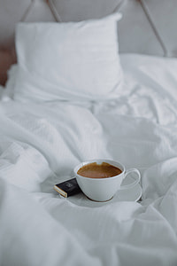 Morning coffee with chocolate in bed thumbnail