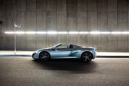 Silver Mclaren 650s Convertible Coupe on Gray Concrete Road thumbnail