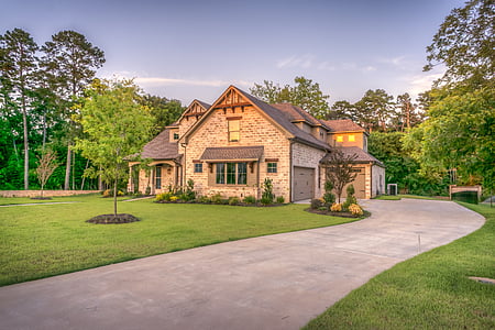 low angle view of lighted house under blue calm sky thumbnail