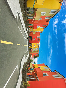 asphalt road between red house thumbnail