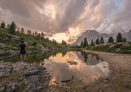 body of water under gray cloudy sky thumbnail