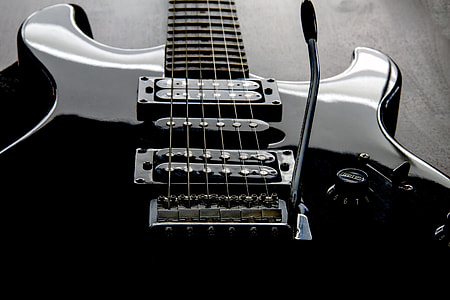 focus photo of black electric guitar thumbnail