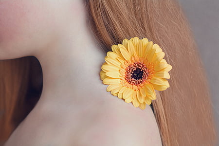 yellow sunflower on woman's nape thumbnail
