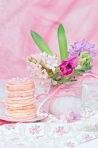 pink and green flower centerpiece in white ceramic vase thumbnail