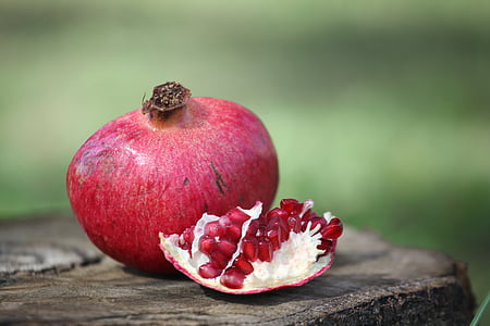 chopped red fruit on tree stump thumbnail