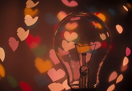 closeup photography of clear glass bulb with heart backgrounds thumbnail