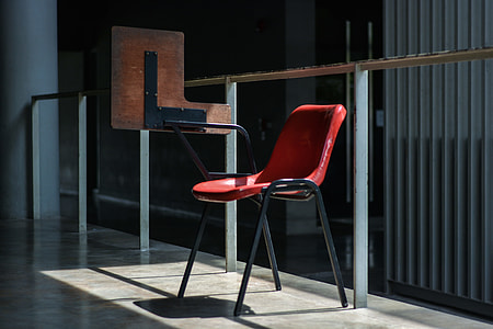writing chair beside fence thumbnail