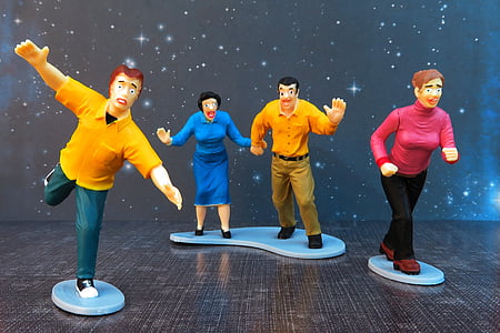 four ceramic figurine of humans thumbnail