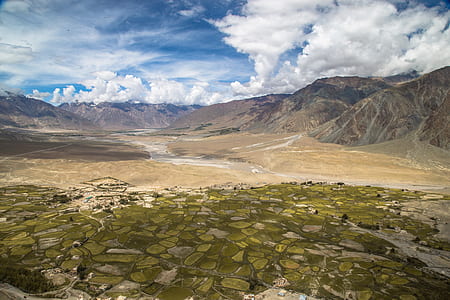 landscape photography of a brown field with mountain thumbnail