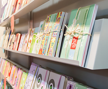 assorted organizers and notebooks on shelf thumbnail